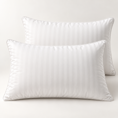 Studio presentation of two white striped queen pillows